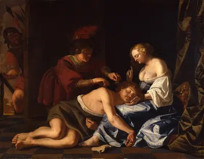 While Samson sleeps in Delilah’s lap, a Filistine cuts off his hair (Judges 16;19) by Christiaen van Couwenbergh, 1630 —…
