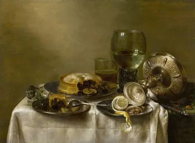 A still life with an overturned silver tazza, glassware, pies and a peeled lemon on a table by Willem Claesz Heda, 1633 —…