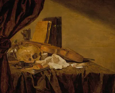 A vanitas still life with a skull, musical instruments, books, playing cards, an ink pot, an overturned tazza and an oil…