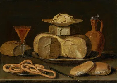 A stack of cheese on a pewter platter, with butter on a plate, a stoneware jug, bread, pretzels, wine in a façon-de-Venise…