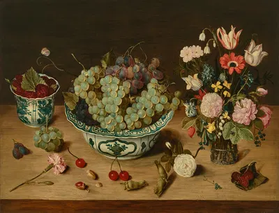 Grapes in a wan-li porcelain kraak, raspberries in a wan-li beaker, tulips, roses and other flowers in a glass vase by…