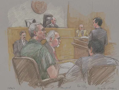 Robert Allen Stanford, seated in courtroom with lawyers, judge, and others during his trial for financial fraud by Brigitte…