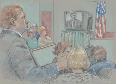 Jury and others watching videotaped deposition of Bill Clinton during fraud and conspiracy trial of James McDougal, which…